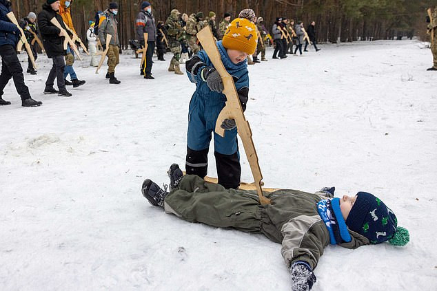 Ukrainian children as young as four are trained by military on how to shoot and defend their borders from Russian invasion (photos) 	