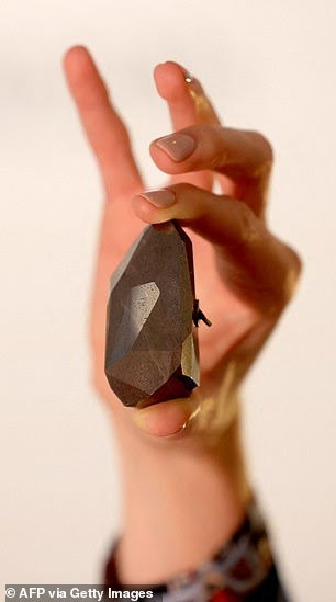 Black 555.55-carat formed 2 billion years ago sells for $4.28 million at auction