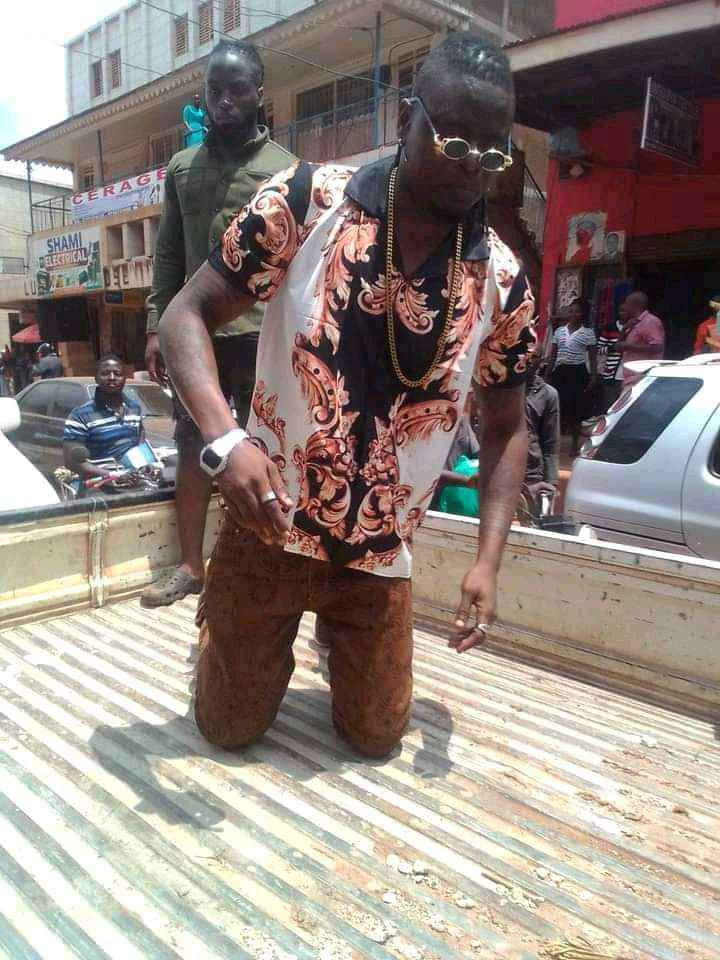 Popular Ugandan singer forced to sweep streets after turning up late for music show (photos/video) 