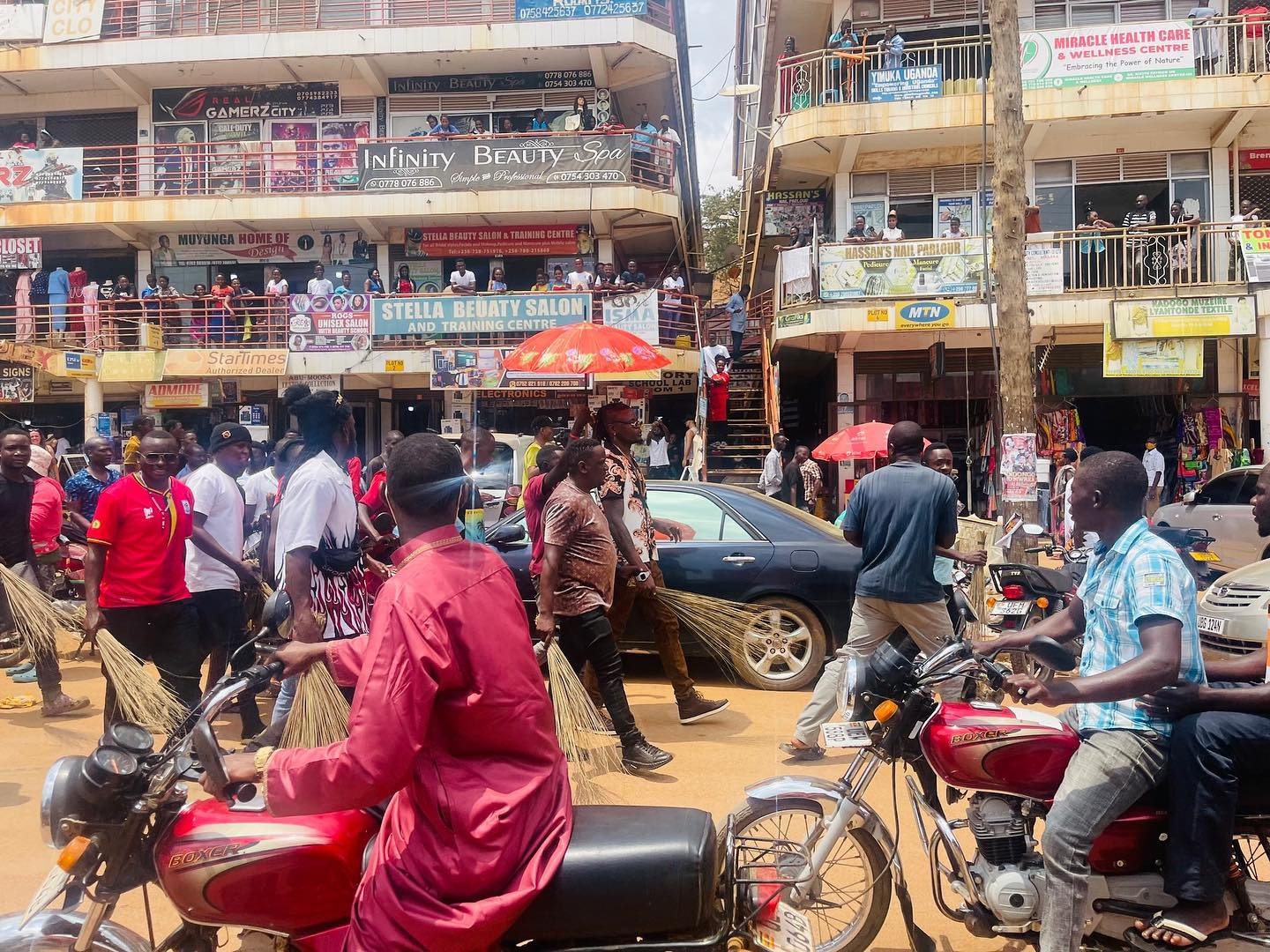 Popular Ugandan singer forced to sweep streets after turning up late for music show (photos/video) 