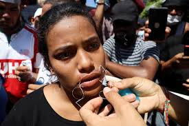 Migrants sew their mouths shut as they begin a hunger strike to demand free transit through Mexico to US border (photos)