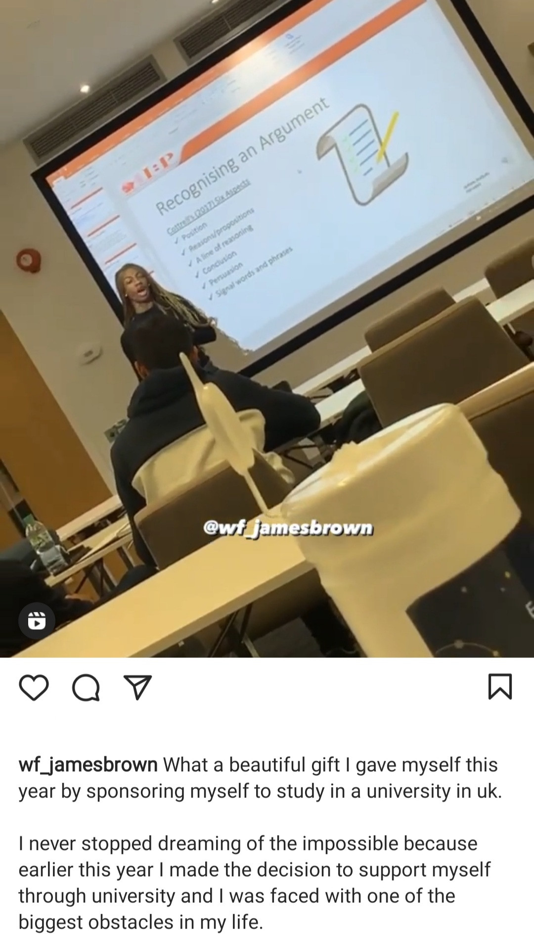 James Brown gives presentation in front of his coursemates during a class in UK (video)