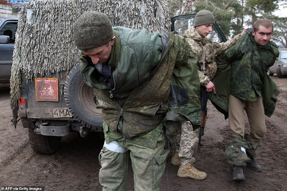 Ukraine troops capture enemy soldiers and parade them after shooting down Russian helicopters, dozens of tanks and entire battalion 