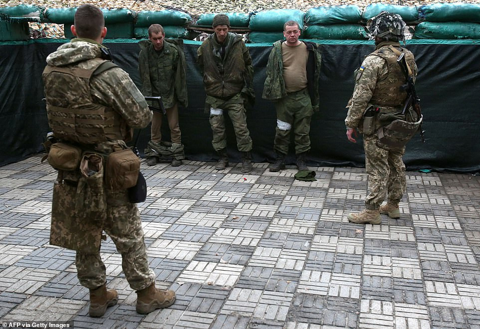 Ukraine troops capture enemy soldiers and parade them after shooting down Russian helicopters, dozens of tanks and entire battalion 