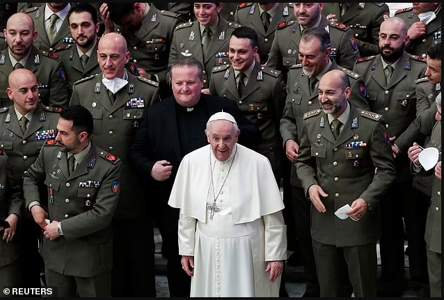 Pope Francis tells Italian Army officers to remove their Covid masks as they pose for a photo at the Vatican (photos)