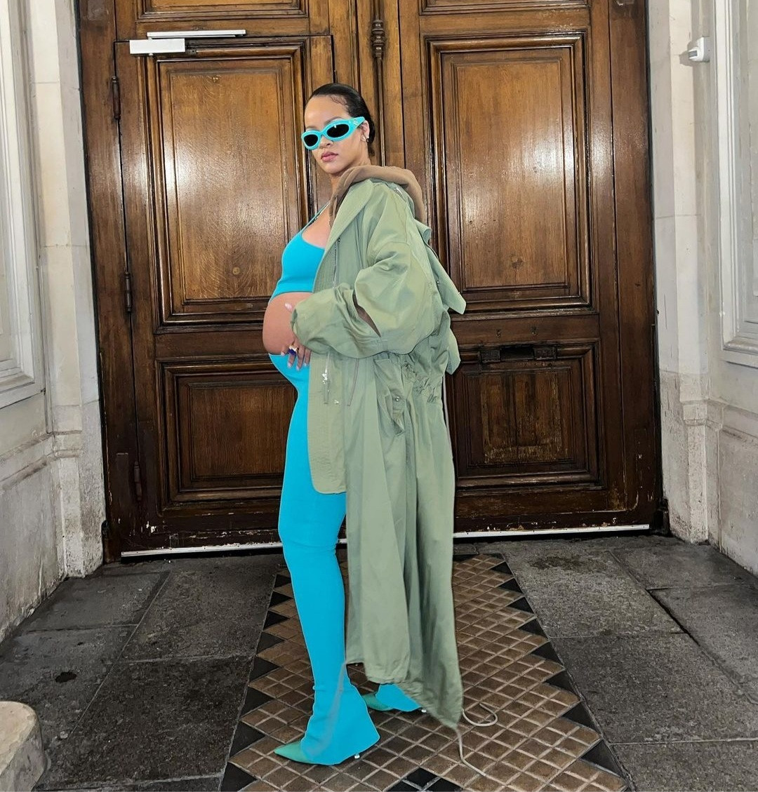 Rihanna steps out in a cut-out jumpsuit that put her bump on display at Paris Fashion Week (photos)