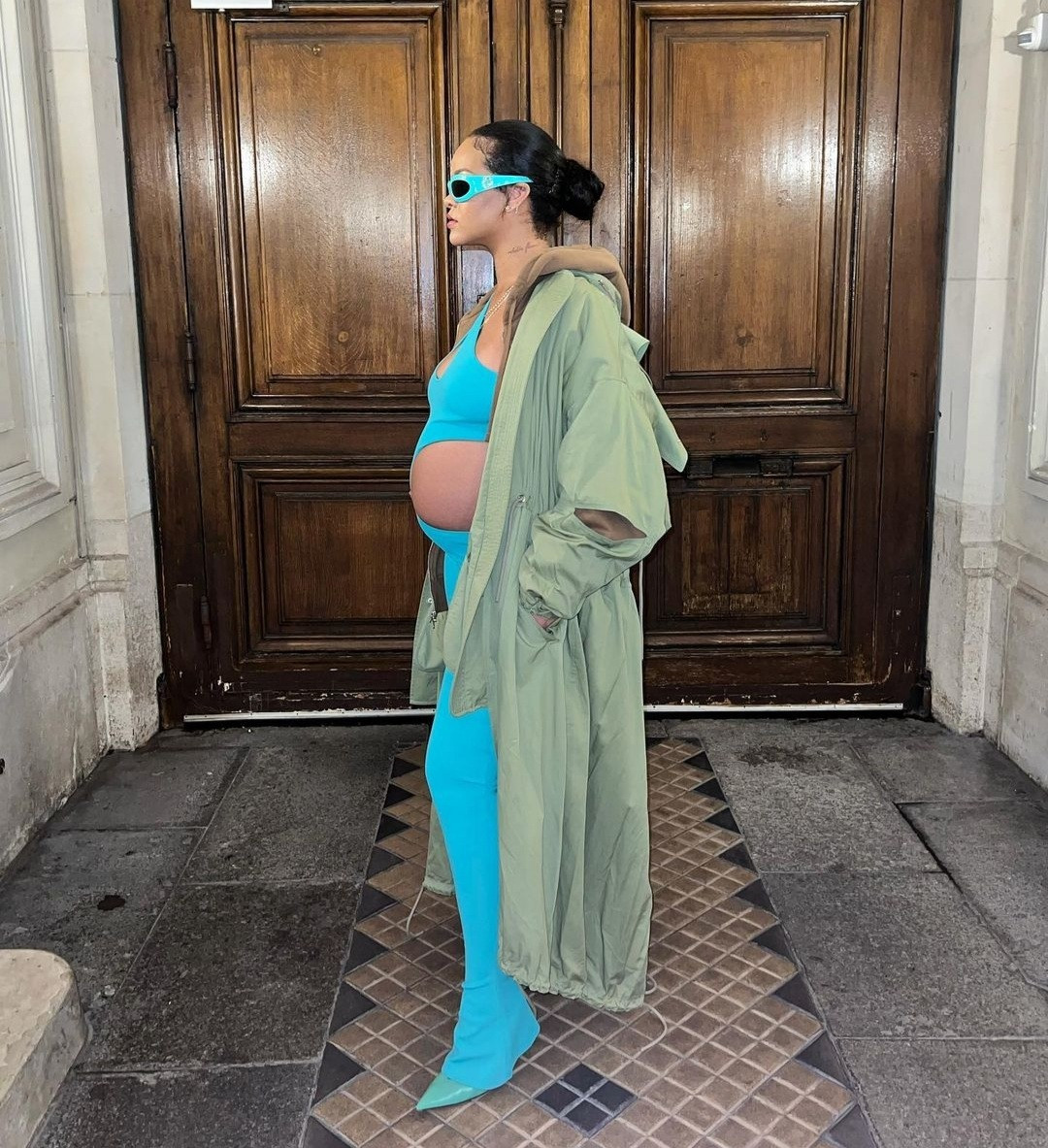 Rihanna steps out in a cut-out jumpsuit that put her bump on display at Paris Fashion Week (photos)