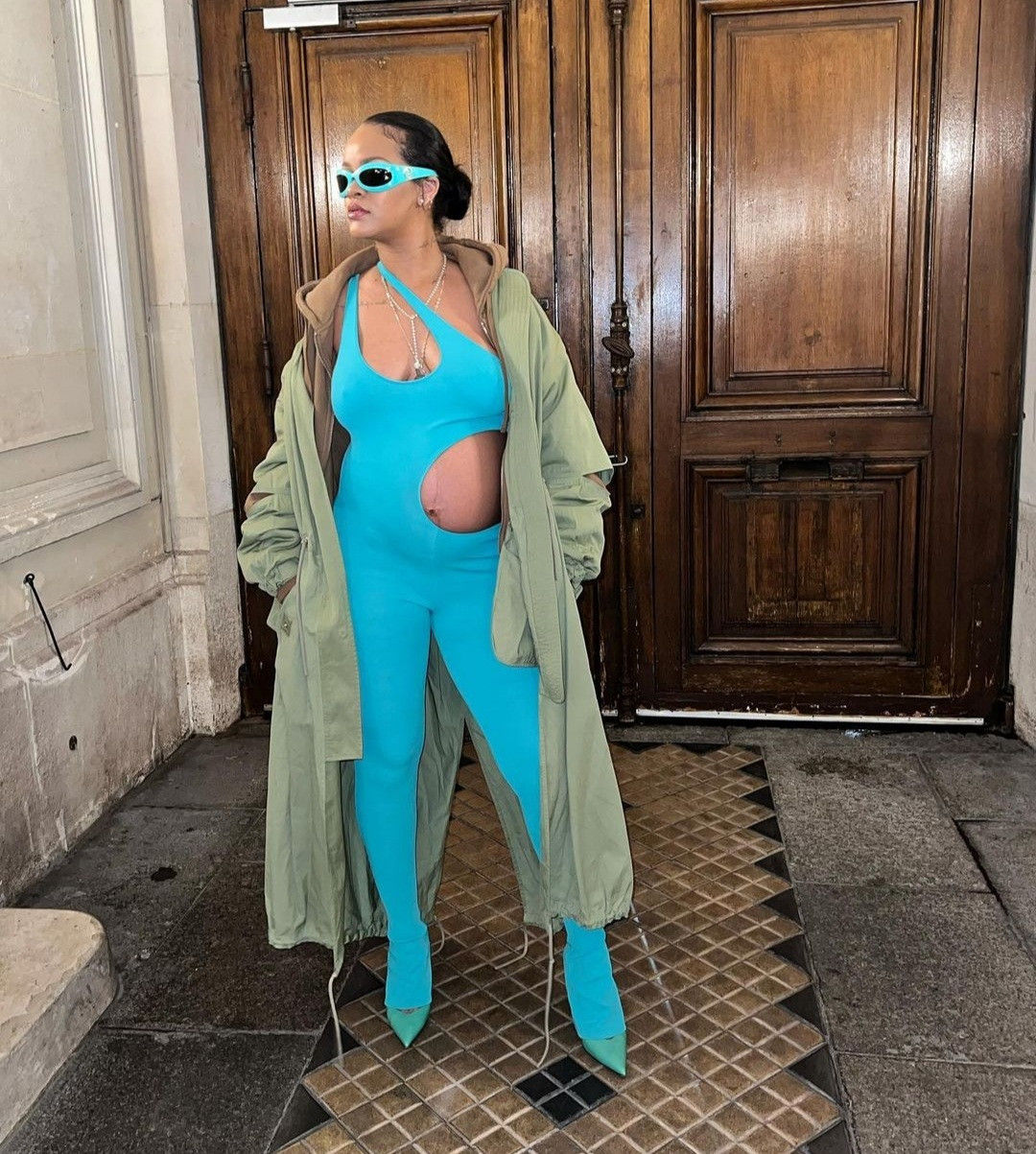 Rihanna steps out in a cut-out jumpsuit that put her bump on display at Paris Fashion Week (photos)