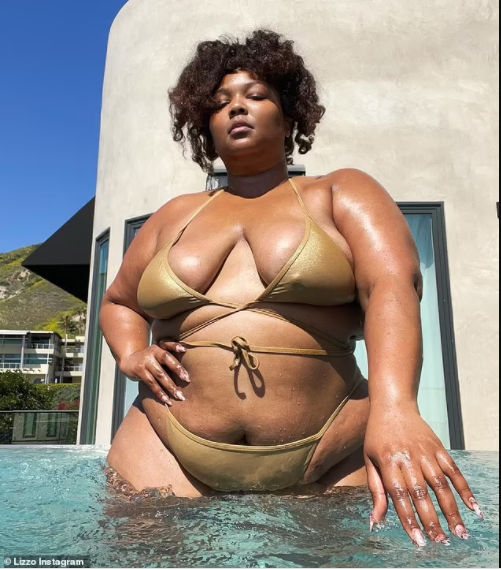 Singer, Lizzo showcases her curves in a shimmering gold string bikini 