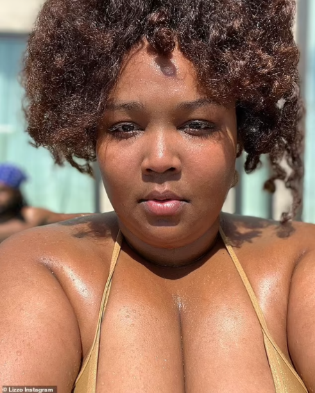 Singer, Lizzo showcases her curves in a shimmering gold string bikini 