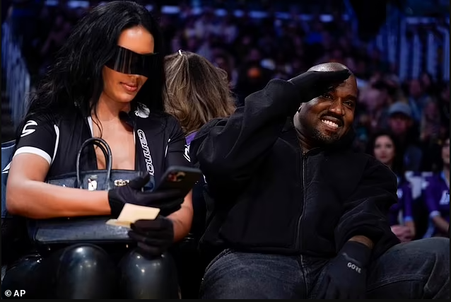 Kanye West all smiles as he sits courtside with his new girlfriend Chaney Jones at the Lakers after ex Kim Kardashian made her relationship with Pete Davidson Instagram official (photos) 