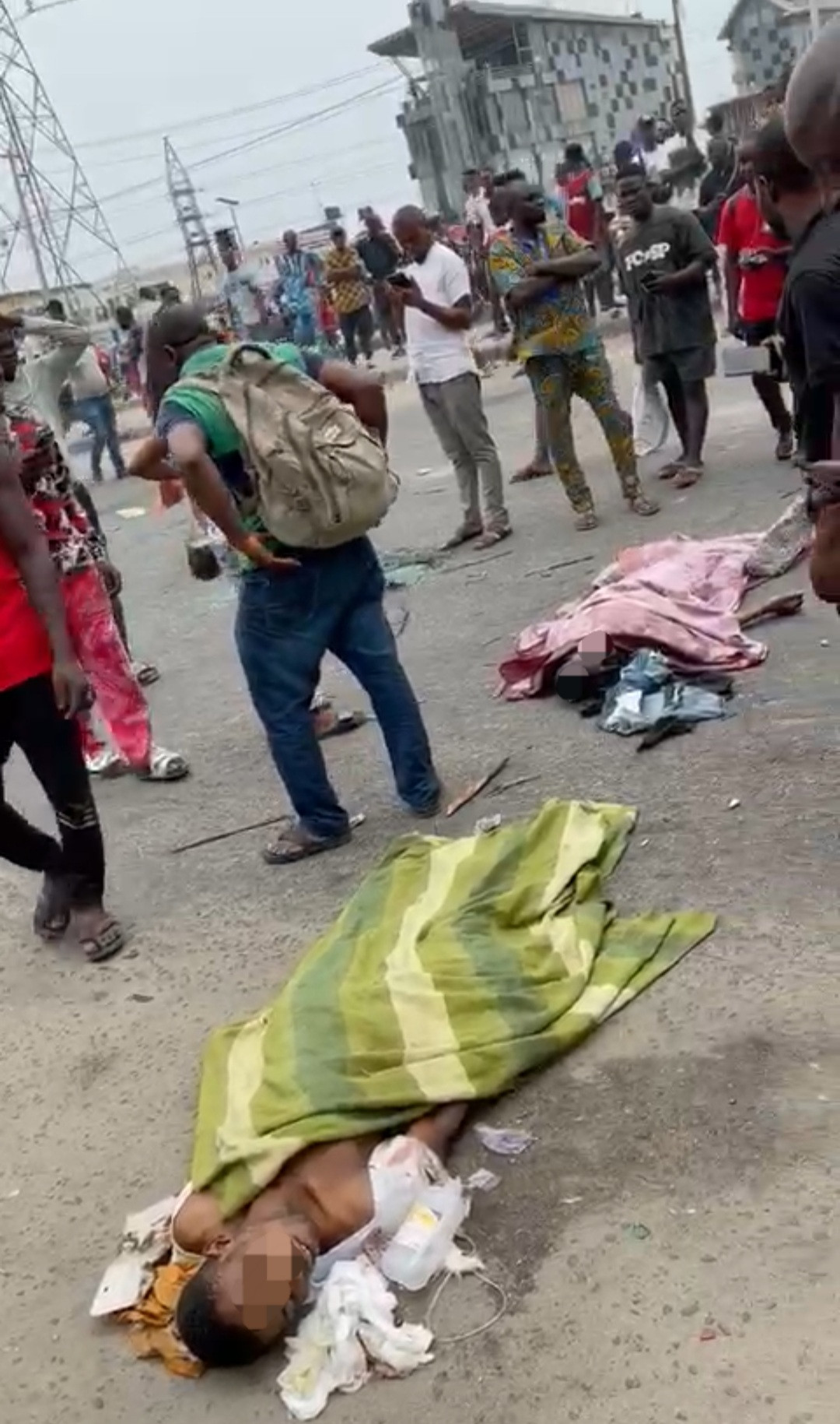 Chaos in Ajah as area boys go on rampage after a truck hit and killed two young men on a bike (graphic photos/videos)