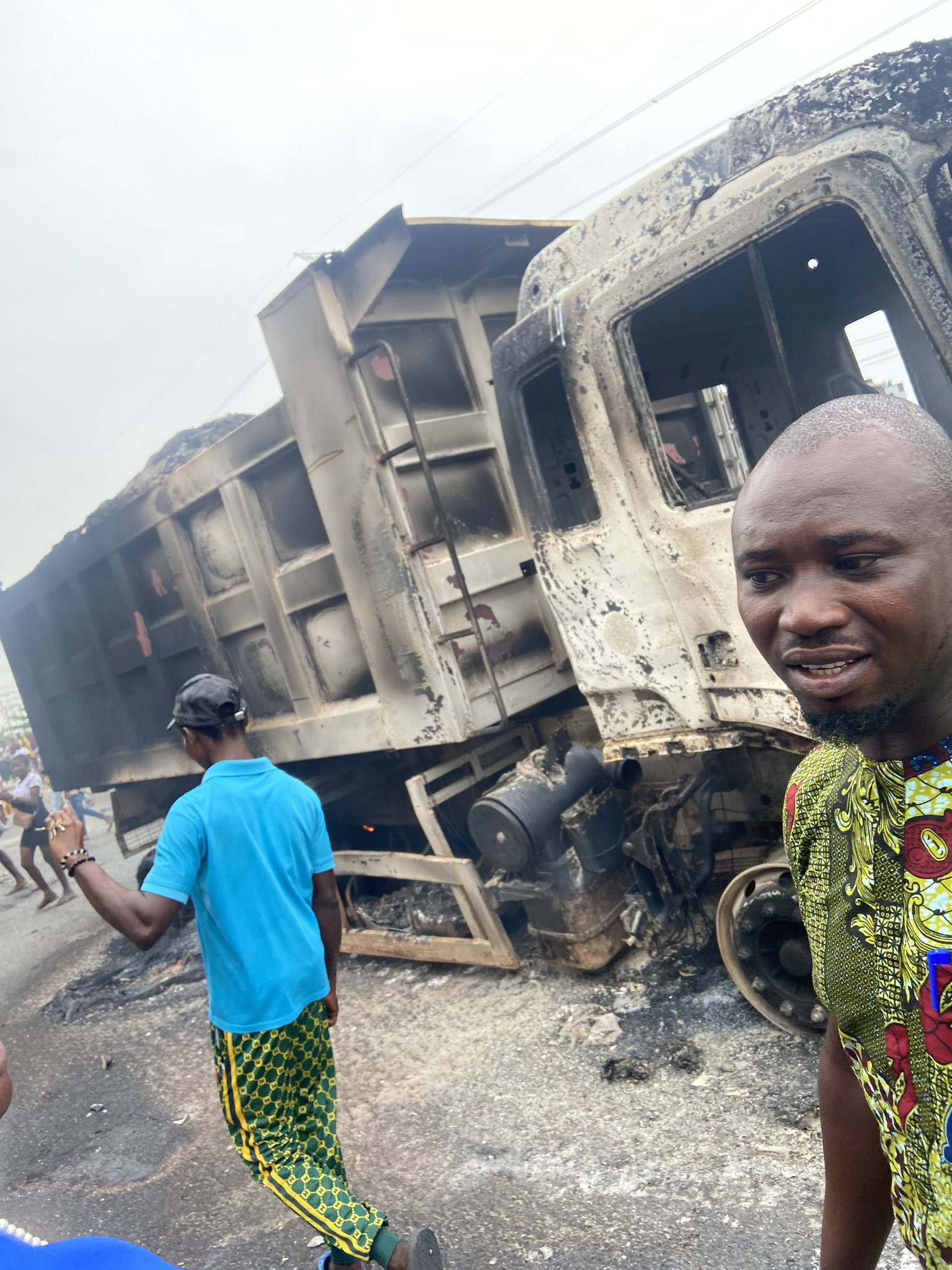 Chaos in Ajah as area boys go on rampage after a truck hit and killed two young men on a bike (graphic photos/videos)