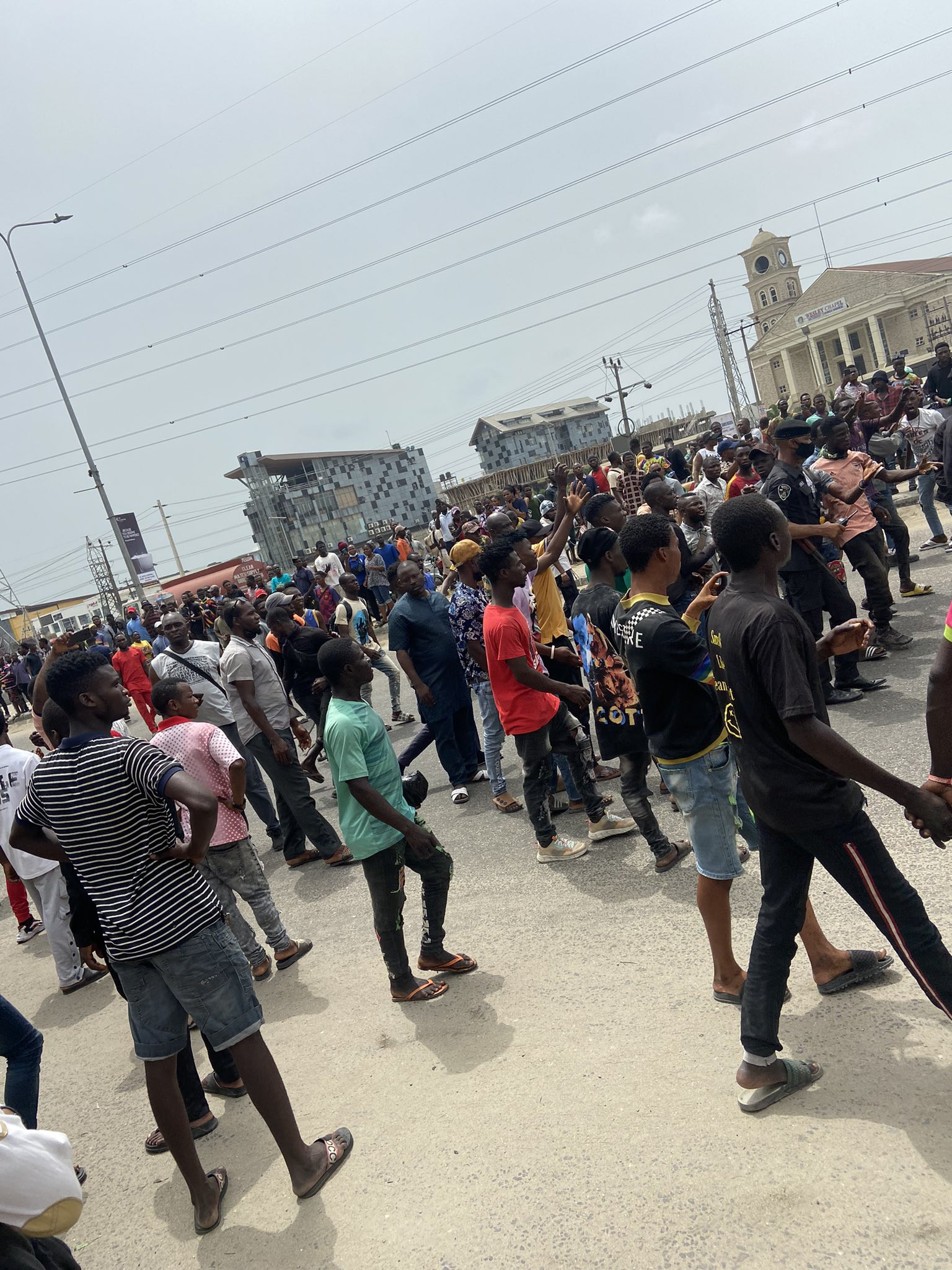 Chaos in Ajah as area boys go on rampage after a truck hit and killed two young men on a bike (graphic photos/videos)